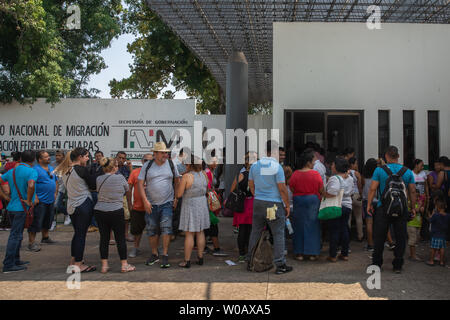 Migrants wait in line to apply for an exit visa or a regional visitor visa in front of (INM) Instituto Nacional de Migración Delegación Federal en Chiapas office in Tapachula, Mexico on May 9, 2019.    Photo by Ariana Drehsler/UPI Stock Photo
