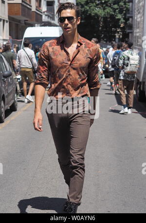 MILANO, Italy: 16 June 2019: Fashion bloggers street style outfits during Milano Fashion Week man  2019/2020 Stock Photo