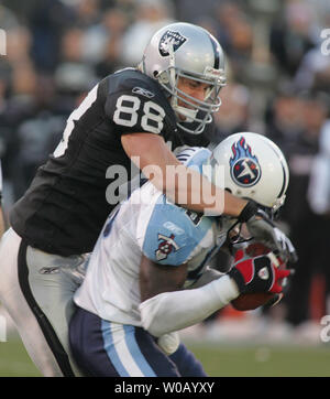 Dallas Cowboys fullback Julius Crosslin, left, and Tennessee Titans