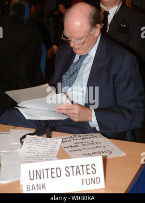 DXB2003092305 - DUBAI, U.A.E., Sept. 23 (UPI) -- U.S. Secretery John Snow reviews his notes for his address to the openning ceremony of the Annual Meeting of the Board of Governors for the IMF and World Bank being hosted in Dubai, United Arab Emirates on Sept. 23, 2003.    rlw/cac/Charles Crowell     UPI Stock Photo