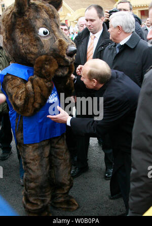 Russian President Vladimir Putin greets a symbolic bear in city of Ufa upon his arrival for a one-day visit to the Russian province of Bashkortostan in the Volga River region, about 1,200 kilometers (750 miles) east of Moscow on October 11, 2007. (UPI Photo/Anatoli Zhdanov). Stock Photo