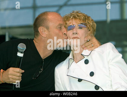 A star of soap opera General Hospital, Corbin Bernsen (plays Joe Durant) kisses his mother Jeanne Cooper (plays Katherine Chancellor) a star of The Young and the Restless during a Q & A with fans before their next function as special guests of the official Pacific National Exhibition opening day celebration parade in Vancouver, August 20, 2005.  (UPI Photo/Heinz Ruckemann) Stock Photo