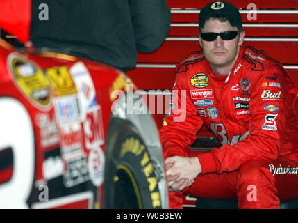 NASCAR race car driver Dale Earnhardt Jr. sits in his garage as his crew works on the race car during DIRECTV 500 practice at the Martinsville Speedway in Martinsville, VA on March 31, 2006. (UPI Photo/Nell Redmond) Stock Photo