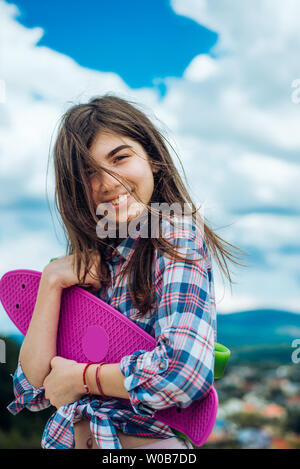 skateboard sport hobby. Summer activity. Hipster girl with penny board. Urban scene, city life. plastic mini cruiser board. Spring. ready to ride on Stock Photo