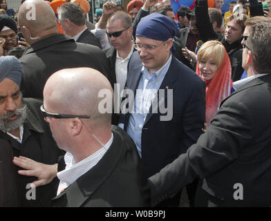 Laureen, the wife of Canada's Conservative Prime Minister Stephen Harper  gets off the campaign bus to join her husband as they visit Vaisaikhi  celebrations on a 2011 Federal Election Campaign stop in