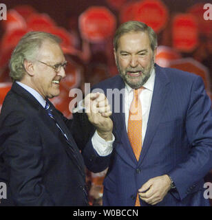 Federal NDP leader Thomas Mulcair greets former Ontario NDP leader Stephen Lewis (L) before speaking to several thousand supporters during a rally late in the summer/fall federal election campaign in Vancouver, British Columbia, October 17, 2015. Voters go to the polls on October 19, 2015. UPI/Heinz Ruckemann Stock Photo