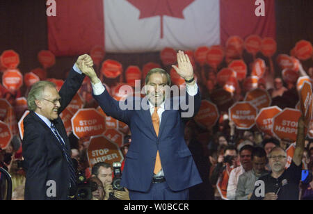 Federal NDP leader Thomas Mulcair greets former Ontario NDP leader Stephen Lewis (L) before speaking to several thousand supporters during a rally late in the summer/fall federal election campaign in Vancouver, British Columbia, October 17, 2015. Voters go to the polls on October 19, 2015. UPI/Heinz Ruckemann Stock Photo