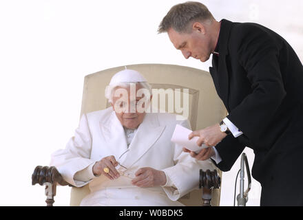 Private Secretary Monsignor Georg Gaenswein confers with Pope Benedict XVI during his weekly general audience in St. Peter's square at the Vatican, on March 7, 2012.     UPI/Stefano Spaziani Stock Photo