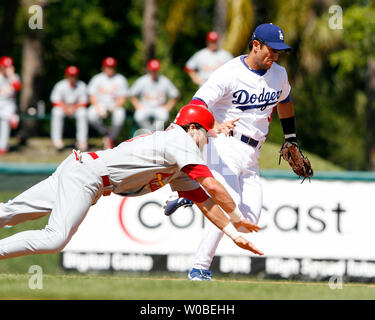 Los Angeles Dodgers Nomar Garciaparra (R) loses a foot race to first base with the St. Louis Cardinals Tagg Bozied during game at Dodgertown in Vero Beach, Florida on March 7, 2007. The  Cardinals beat the Dodgers 11-1.  (UPI Photo /Jon SooHoo) Stock Photo