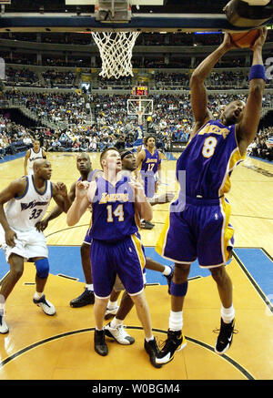 Kobe Bryant of the Los Angeles Lakers pulls down a rebound on the way to a triple double against the Washington Wizards in a game on won by the Lakers 122-110 on Feb. 28, 2004, at the MCI Center in Washington.  Bryant had 14 rebounds and 10 assists to go along with his 25 points. (UPI Photo/Mark Goldman) Stock Photo