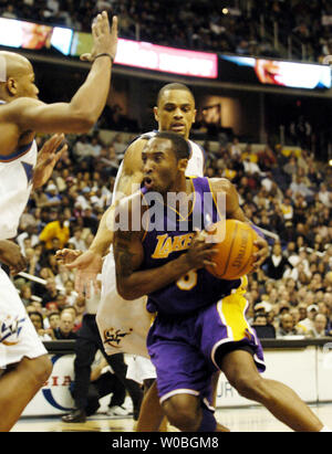 Kobe Bryant of the Los Angeles Lakers 2 of his 25 points on the way to a triple double against the Washington Wizards in a game on won by the Lakers 122-110 on Feb. 28, 2004, at the MCI Center in Washington.  Bryant had 14 rebounds and 10 assists to go along with his 25 points. (UPI Photo/Mark Goldman) Stock Photo