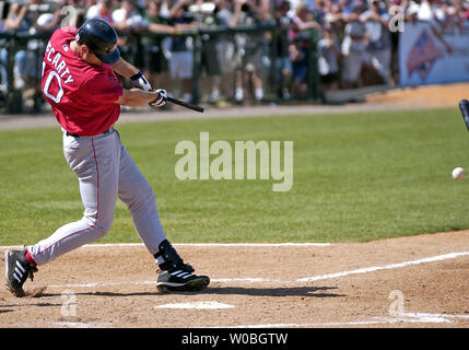 Boston Red Sox's Manny Ramirez kisses a bat as he returns to the plate from  the dug out after breaking a bat in the first inning of a baseball game  against the