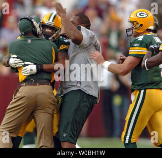 Green Bay Packer cornerback. Al Harris intercepts a Mark Brunell pass late  in the fourth quarter as the Green Bay Packers defeated the Washington  Redskins 28-14 on Sunday October 31, 2004 at