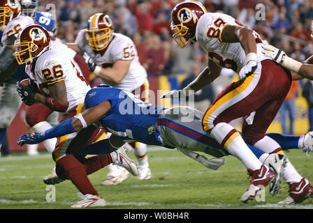 Washington Redskins Clinton Portis (26) breaks the tackle of New York Jets  Victor Hobson (54) in the first quarter at Giants Stadium in East  Rutherford, New Jersey on November 4, 2007. The