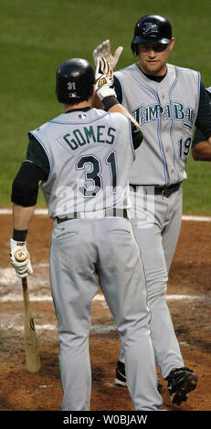 The Tampa Bay Devil Rays Aubrey Huff (R) is congratulated by Jonny Gomes (31) after hitting a three run home run scoring Carl Crawford and Julio Lugo in the fourth inning against the Baltimore Orioles Rodrigo Lopez on August 9, 2005.  The Orioles defeated the Devil Rays 9-5 at Orioles Park at Camden Yards in Baltimore, MD. (UPI Photo/Mark Goldman) Stock Photo