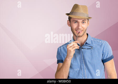 Young handsome man in glasses and hat Stock Photo