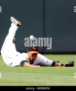 The Baltimore Orioles Ed Rogers (16) cannot make the catch in the first inning on a fly ball by Bernie Williams of the New York Yankees which scored Johnny Damon with the first run at Orioles Park at Camden Yards in Baltimore, MD on June 3, 2006.   The Yankees defeated the Orioles 6-5 in ten innings.  (UPI Photo/Mark Goldman) Stock Photo