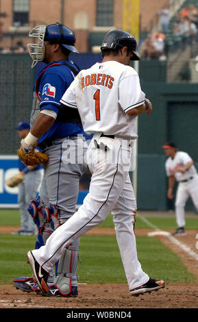 Baltimore Orioles second baseman Brian Roberts hits an RBI single that  scores catcher Paul Bako in the sixth inning against New York Yankees  pitcher Chien-Ming Wang at Orioles Park at Camden Yards