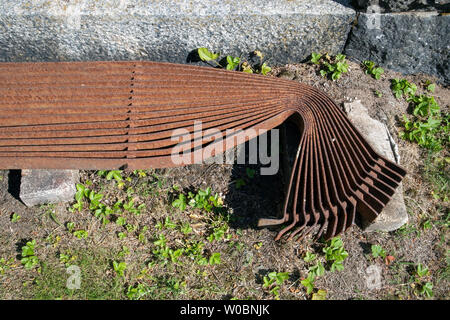 rusty old metal grid on ground Stock Photo