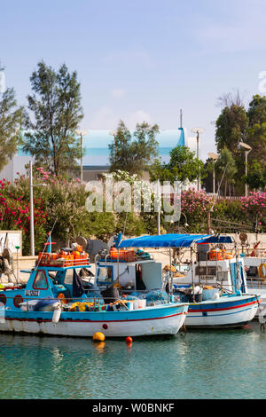 Traditional Cypriot fishing boats in the fishing shelter at Ayia Triada, Paralimni, Cyprus. june 2019 Stock Photo