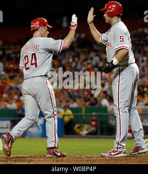 The Philadelphia Phillies Mike Lieberthal (24) comes in to score and is  congratulated by Philadelphia Phillies Pat Burrell after hitting a two run  home run in the fourth inning against the Washington Nationals Tony Armas  on August 29, 2006 at RFK Stadi