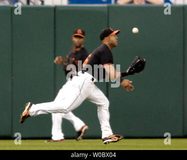 Minnesota Twins' Nick Punto (8) and Carlos Gomez, right, celebrate the Twins'  5-3 win over the Chicago White Sox during a baseball game Tuesday, July 28,  2009, in Minneapolis. (AP Photo/Tom Olmscheid