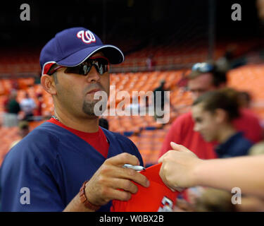 Washington Nationals pitcher Luis Ayala balances a baseball on his left  hand during the first full works out for pitchers and catchers at Space  Coast Stadium in Viera, Fla., Thursday, Feb. 15