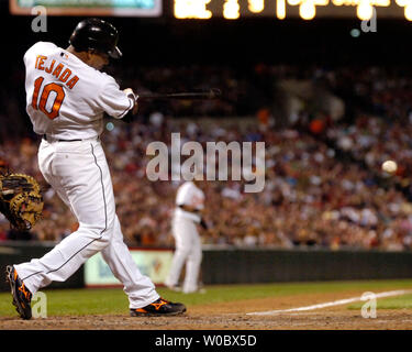 Baltimore Orioles shortstop Miguel Tejada (10) hits an RBI single to score second baseman Brian Roberts in the third inning against Boston Red Sox pitcher Daisuke Matsuzaka at Orioles Park at Camden Yards in Baltimore on September 8, 2007.  (UPI Photo/Mark Goldman) Stock Photo