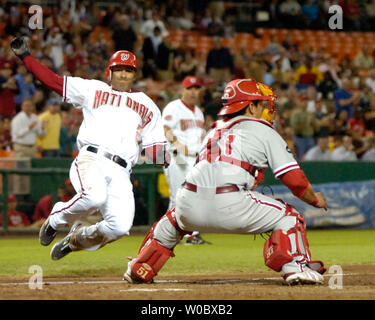 Washington Nationals shortstop Felipe Lopez (2) slides safely into home in the second inning on a double by second baseman Ronnie Belliard as Philadelphia Phillies catcher Carlos Ruiz (51) waits for the throw on September 20, 2007 at RFK Stadium in Washington.  (UPI Photo/Mark Goldman) Stock Photo