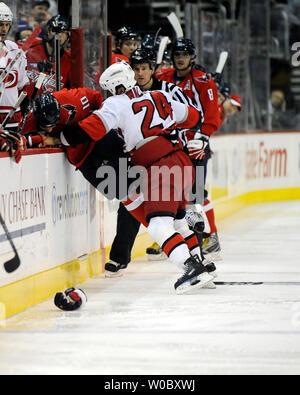 Carolina Hurricanes right wing Scott Walker (24) fights with Washington Capitals right wing Matt Bradley (10) in the first period on February 8, 2008 at Verizon Center in Washington, D.C.  Both players were given penalties.  (UPI Photo/ Mark Goldman) Stock Photo