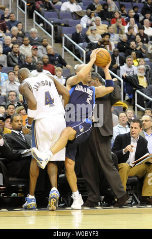 Dallas Mavericks guard Jason Kidd (2) tries to keep the ball in bounds in front of Washington Wizards head coach Ed  Tapscott in the 1st half at Verizon Center in Washington, D.C. on December 21,  2008.  (UPI Photo/ Mark Goldman) Stock Photo