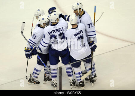 Toronto Maple Leafs defenseman Pavel Kubina (77) of the Czech Republic celebrates his winning goal in the 3rd period with defenseman Ian White (7), center John Mitchell (39) and forward Jeff Hamilton (51) at the Verizon Center in Washington on March 5,  2009.   The Toronto Maple Leafs defeated the Washington Capitals 2-1 sending Washington to their third consecutive loss.  (UPI Photo/ Mark Goldman) Stock Photo