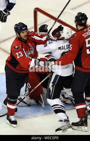 Washington Capitals defenseman Scott Hannan (23) puts  a glove in the face of Tampa Bay Lightning left wing Ryan Malone (6) in the third period at the Verizon Center in Washington on April 29,  2011 in the first game of the NHL Eastern Conference semifinals.   The Tampa Bay Lightning defeated the Washington Capitals 4-2.  UPI/ Mark Goldman Stock Photo