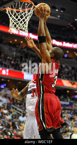 Miami Heat shooting guard Dwyane Wade (3) scores against Washington Wizards small forward Chris Singleton (31) in the first half at the Verizon Center in Washington, D.C. on December 4, 2012.   UPI/Mark Goldman Stock Photo