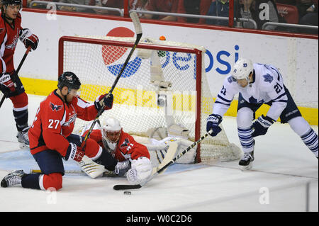 Washington Capitals goalie Jaroslav Halak (41) makes a save on a shot by Toronto Maple Leafs left wing James van Riemsdyk (21) in the first period at the Verizon Center in Washington, D.C. on March 16, 2014.   UPI/Mark Goldman Stock Photo