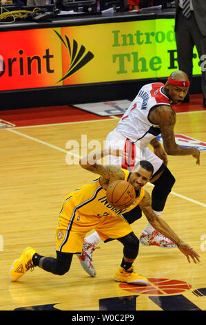 Indiana Pacers guard George Hill (3) looses the ball under the defensive pressure of Washington Wizards forward Al Harrington (7) in the fourth game of the Eastern Conference Semifinals in the first half at the Verizon Center in Washington, D.C. on May 11, 2014.   UPI/Mark Goldman Stock Photo