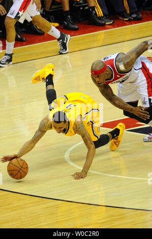 Indiana Pacers guard George Hill (3) dives for a ball after being fouled by Washington Wizards forward Al Harrington (7) in the fourth game of the Eastern Conference Semifinals in the first half at the Verizon Center in Washington, D.C. on May 11, 2014.   UPI/Mark Goldman Stock Photo