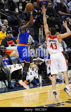 New York Knicks guard Tim Hardaway Jr. (5) scores against Washington Wizards forward Kris Humphries (43) in the first half at the Verizon Center in Washington, D.C. on January 7, 2015.   Photo by Mark Goldman/UPI Stock Photo