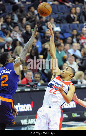 Washington Wizards forward Otto Porter Jr. (22) scores over the defense of Phoenix Suns guard Eric Bledsoe (2) in the first half at the Verizon Center in Washington, D.C. on December 4, 2015.   Photo by Mark Goldman/UPI Stock Photo