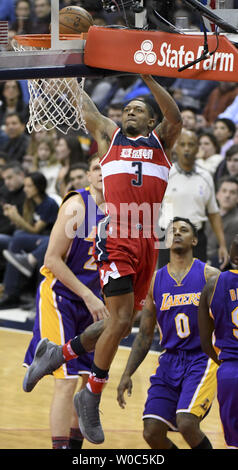 Washington Wizards guard Bradley Beal (3) dunks the ball against Los Angeles Lakers guard Nick Young (0) in the first half at the Verizon Center in Washington, D.C. on February 2, 2017.   Photo by Mark Goldman/UPI Stock Photo