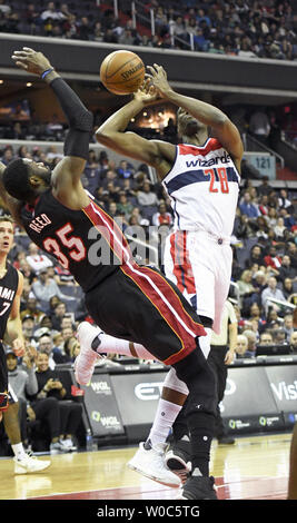 Washington Wizards center Ian Mahinmi (28) is fouled by Miami Heat forward Willie Reed (35) in the first half at the Verizon Center in Washington, D.C. on April 8, 2017.   Photo by Mark Goldman/UPI Stock Photo