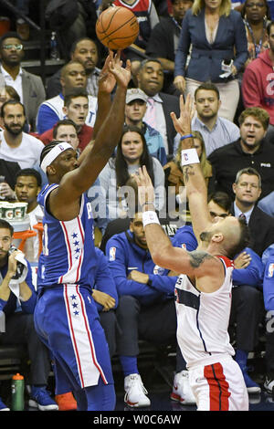 Philadelphia 76ers center Joel Embiid (21) scores against Washington Wizards center Marcin Gortat (13) in the first half at the Capital One Arena in Washington, D.C. on October 18, 2017. Photo by Mark Goldman/UPI Stock Photo