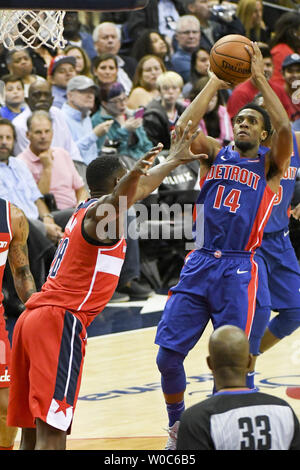 Detroit Pistons guard Ish Smith (14) scores against Washington Wizards center Ian Mahinmi (28) in the first half at the Capital One Arena in Washington, D.C. on October 20, 2017. Photo by Mark Goldman/UPI Stock Photo