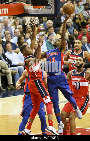 Detroit Pistons guard Ish Smith (14) scores against Washington Wizards guard Tim Frazier (8) in the first half at the Capital One Arena in Washington, D.C. on October 20, 2017. Photo by Mark Goldman/UPI Stock Photo