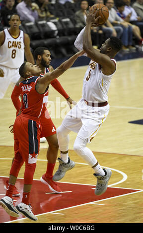 Cleveland Cavaliers guard Dwyane Wade (9) scores and is fouled by Washington Wizards guard Tim Frazier (8) in the first half at Capital One Arena in Washington, D.C. on November 3, 2017.  Photo by Mark Goldman/UPI Stock Photo