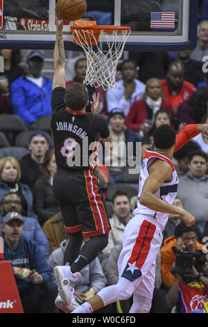 Miami Heat guard Tyler Johnson (8) scores over Washington Wizards forward Otto Porter Jr. (22) in the first half at Capital One Arena in Washington, D.C. on March 6, 2018.  Photo by Mark Goldman/UPI Stock Photo