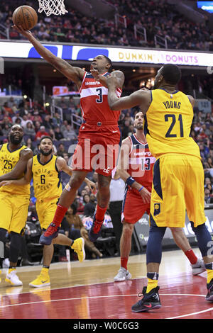 Washington Wizards guard Bradley Beal (3) scores against Indiana Pacers forward Thaddeus Young (21) in the first half at Capital One Arena in Washington, D.C. on March 17, 2018.  Photo by Mark Goldman/UPI Stock Photo