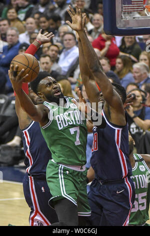 Boston Celtics guard Jaylen Brown (7) scores against Washington Wizards center Ian Mahinmi (28) in the first half at Capital One Arena in Washington, D.C. on April 10, 2018.  Photo by Mark Goldman/UPI Stock Photo