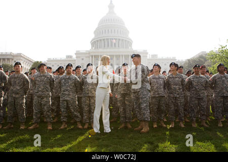 Army Reserve Chief Lt. Gen. Jack Stultz greets Miss America 2008 Kirsten Haglund during an Army Reserve event to re-enlist 100 Reserve soldiers on the west lawn of the Capitol in Washington on April 23, 2008. (UPI Photo/Patrick D. McDermott) Stock Photo