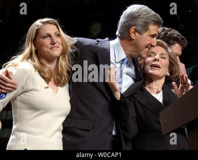 Teresa Heinz Kerry hugs her son Chris, left, and Andre, right, after